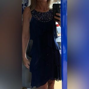 Dark blue tiered dress with sequin accent at collar. SLNY size 4